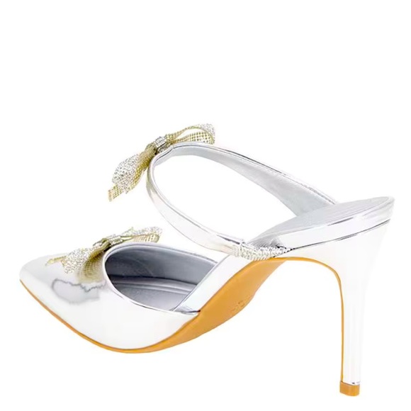 New BCBGeneration
Bardia Metallic Patent Rhinestone Bows Dress Mules - Picture 5 of 13